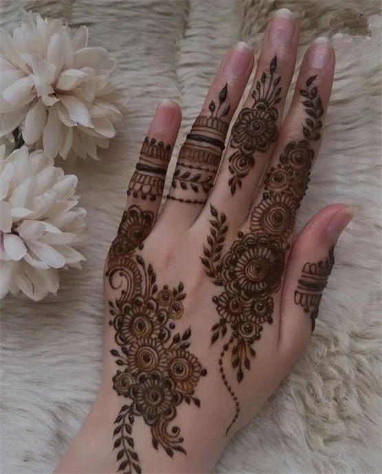 Ornate Peacock Accent Blending Into Back Hand Mehndi Design
